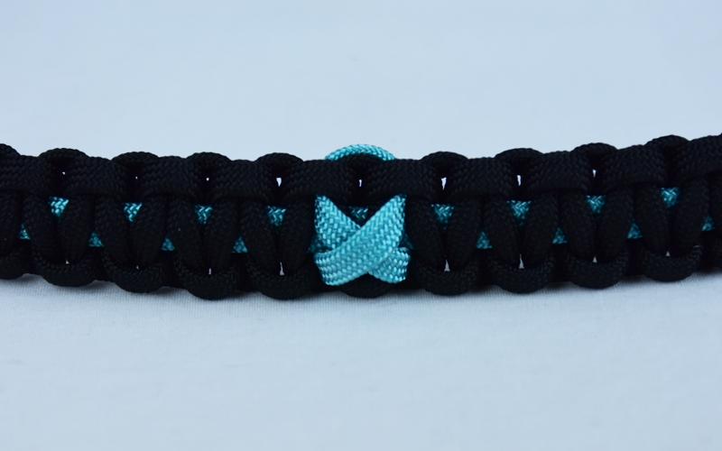 teal and black ptsd support paracord bracelet with teal ribbon in the center