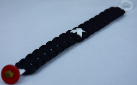 white and black multiple sclerosis support paracord bracelet with red button corner and white ribbon